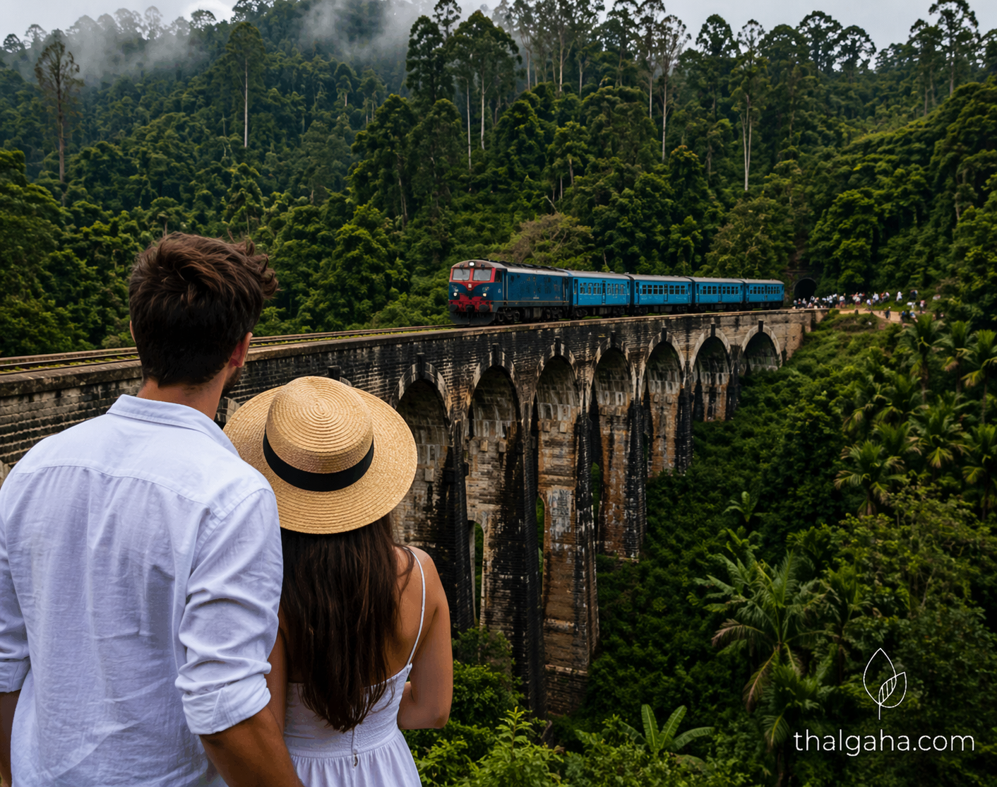 a couple looking at the nine-arch bridge in Sri Lanka